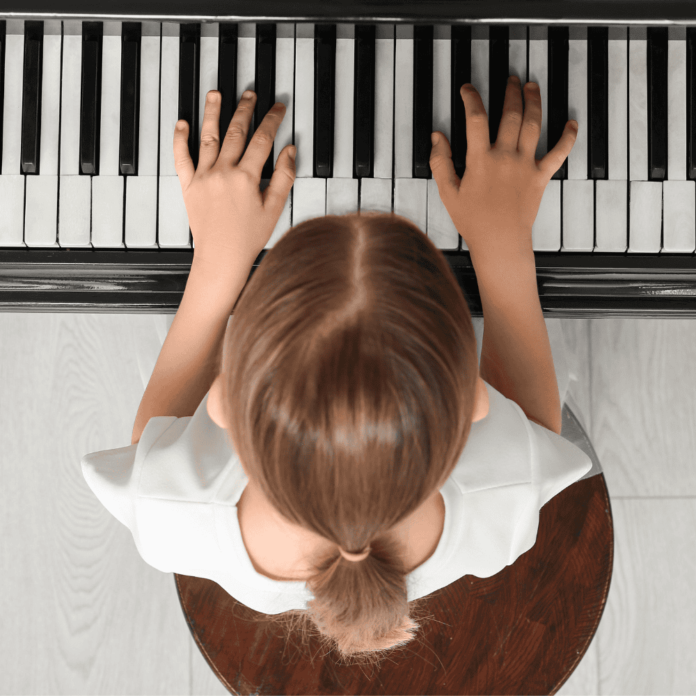 Child learning at a piano